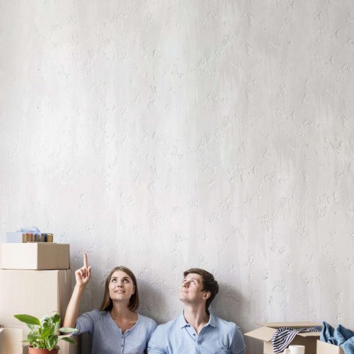 couple-home-packing-move-out-pointing-up